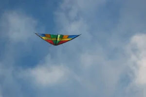 Real colorful stunt kite flying in a cloudy sky